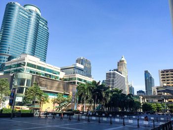 View of buildings against clear blue sky