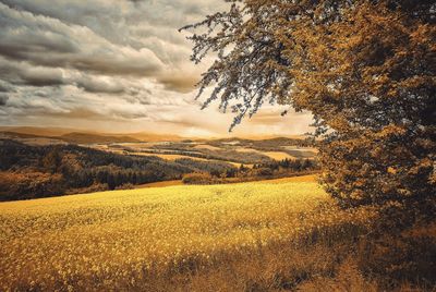 Countryside landscape against clouds