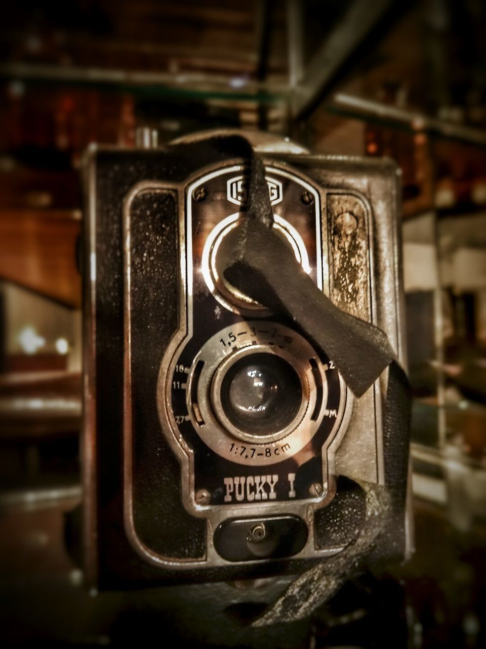 technology, indoors, communication, close-up, old-fashioned, metal, retro styled, number, focus on foreground, text, connection, photography themes, music, machinery, equipment, telephone, camera - photographic equipment, old, selective focus, machine part