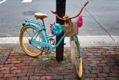 Bicycle on sidewalk by street