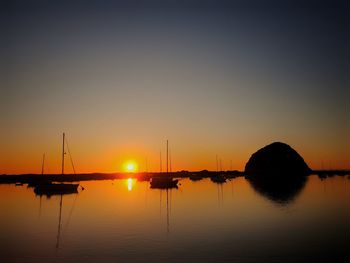 Silhouette of marina at sunset