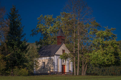 House on field against sky