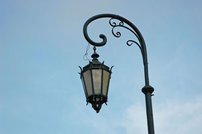 Low angle view of street light against sky