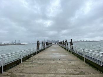 Bridge over sea against sky