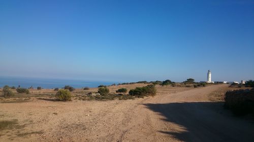 Scenic view of landscape against clear blue sky