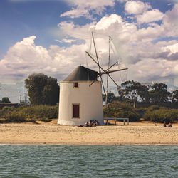 Built structure on beach against sky