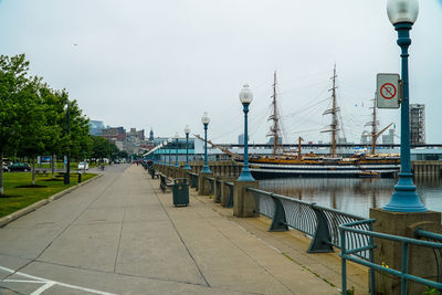 View of boats in city against sky