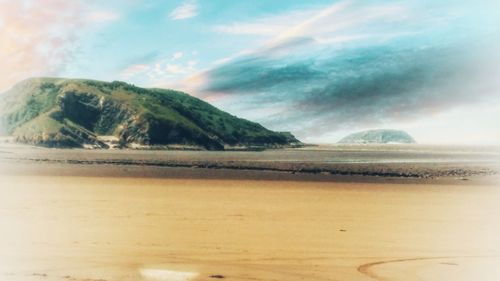 Scenic view of beach against sky