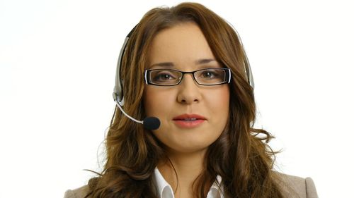 Portrait of beautiful woman against white background