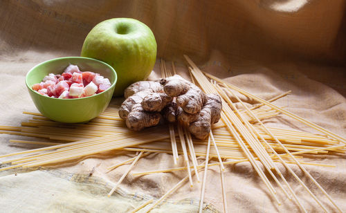 High angle view of fruits in basket on table