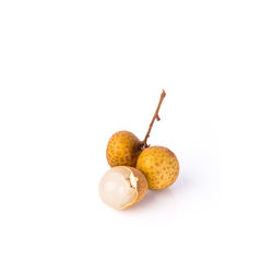 Close-up of fruits against white background