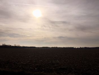 Scenic view of landscape against sky at sunset