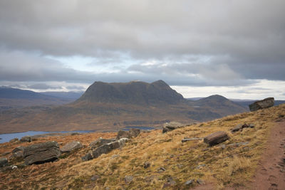 Scenic view of landscape and mountains against sky