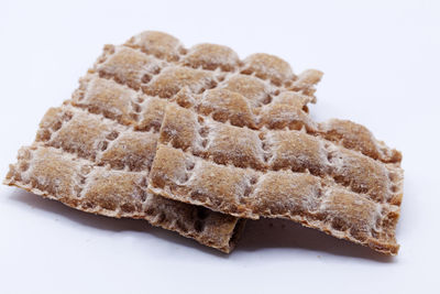 High angle view of chocolate cake against white background