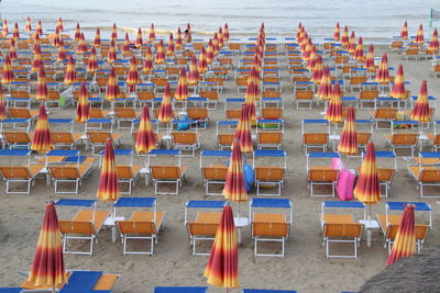 Row of chairs on beach