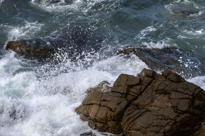 Waves splashing on rocks