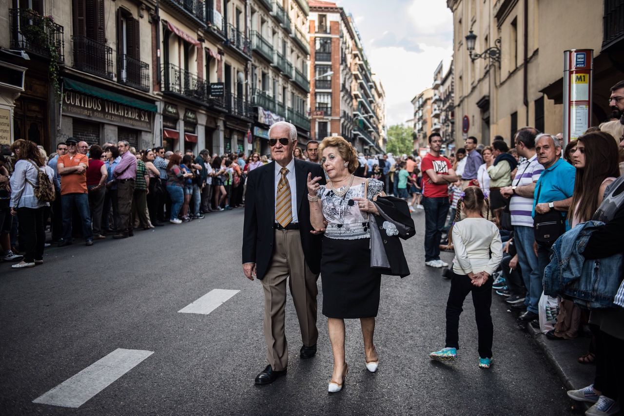 large group of people, lifestyles, person, men, building exterior, leisure activity, architecture, street, casual clothing, built structure, city, city life, walking, crowd, mixed age range, full length, standing, city street, togetherness