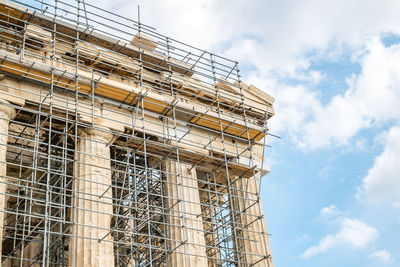 Low angle view of construction site against sky