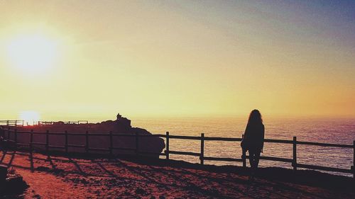 Silhouette of people on beach during sunset