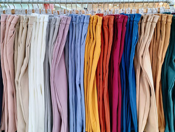 Colorful pants for sale hanging on the rack