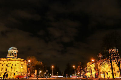 Illuminated city against sky at night