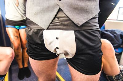 Midsection of man wearing shorts