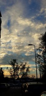 Road against cloudy sky at sunset