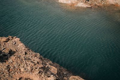 High angle view of rocks in sea