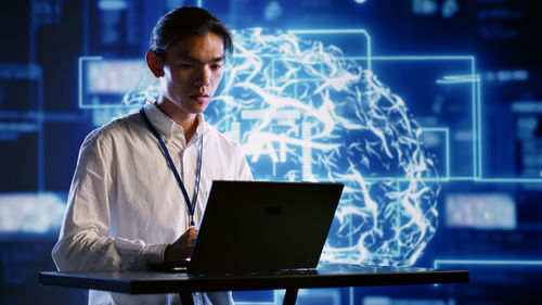 Businesswoman using laptop