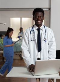 Portrait of doctor working at clinic