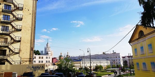 City street amidst buildings against sky