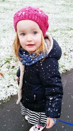 Portrait of smiling girl standing outdoors