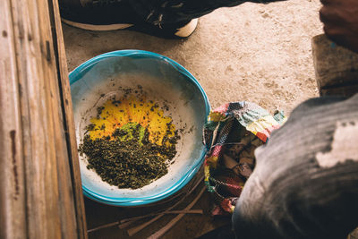 Low section of woman holding food