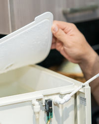 Close-up of hand holding ice cream