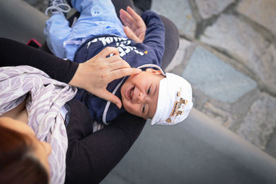 High angle view of mother and son on floor