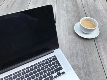 High angle view of coffee cup on table