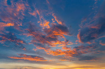 Low angle view of dramatic sky during sunset