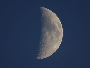 Low angle view of moon against clear sky at night