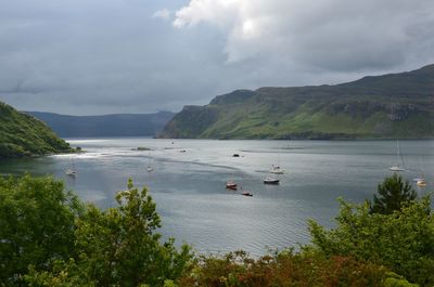 High angle view of boats in lake against sky