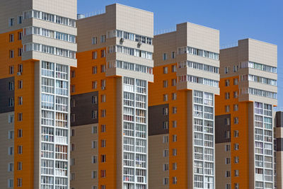 Low angle view of buildings against clear sky