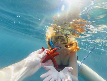 Woman swimming in sea