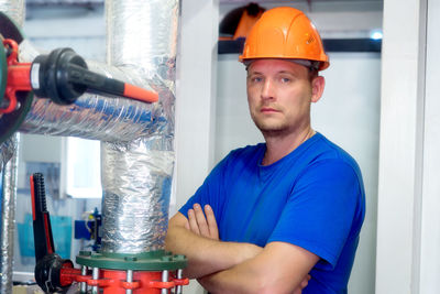 Portrait of man working in factory