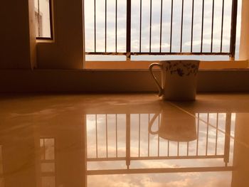 Tea cup on tiled floor at home