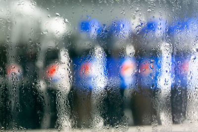 Full frame shot of wet glass window in rainy season