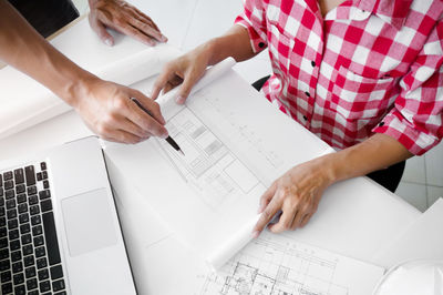 High angle view of man working on table