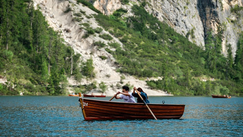 People on boat at shore