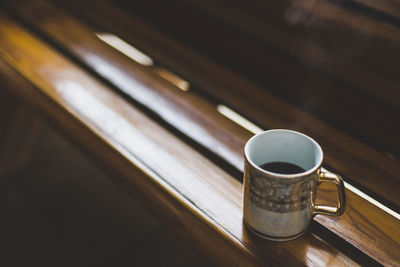 High angle view of coffee cup on table in the church