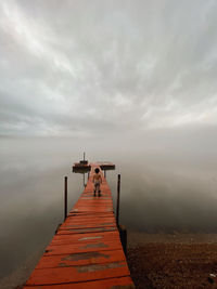 Pier over sea against sky