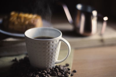 Close-up of coffee cup on table