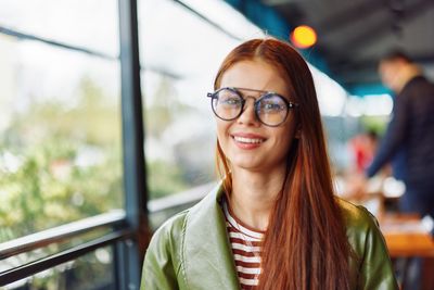 Young woman wearing sunglasses standing outdoors